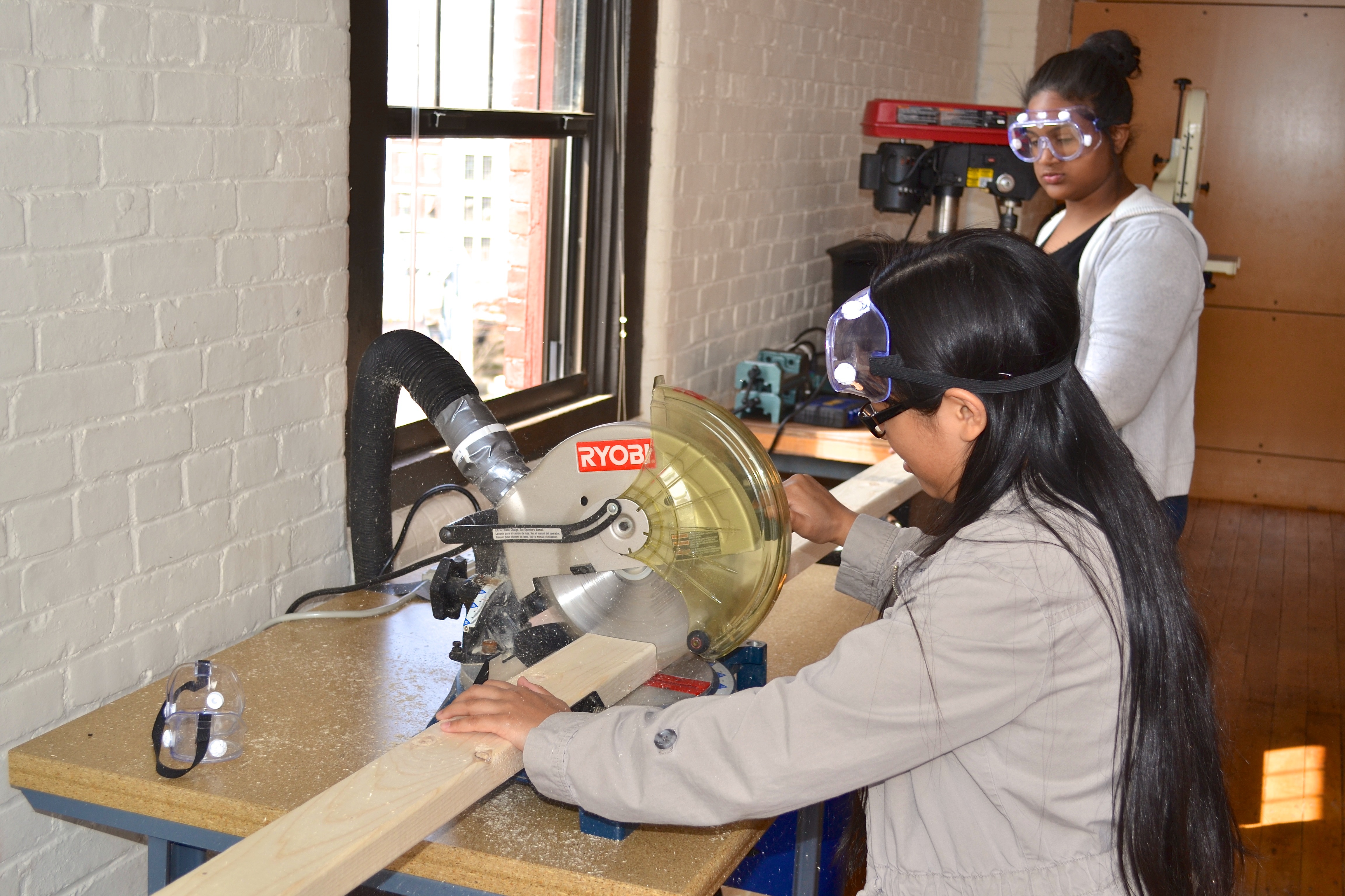 girls using chop saw